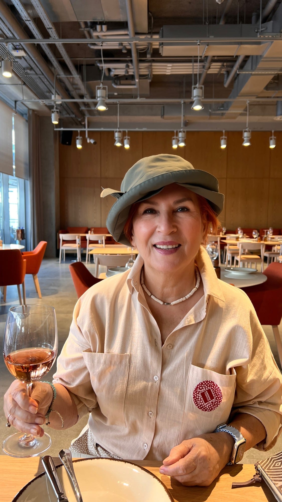 My mother Gülsevin smiling at a restaurant