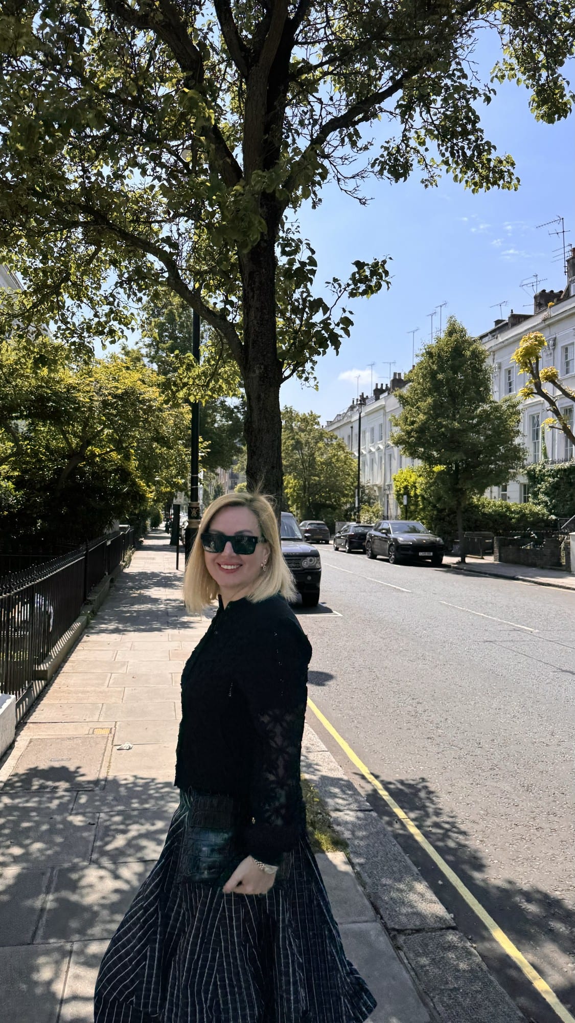 My sister Seden on a tree-lined street